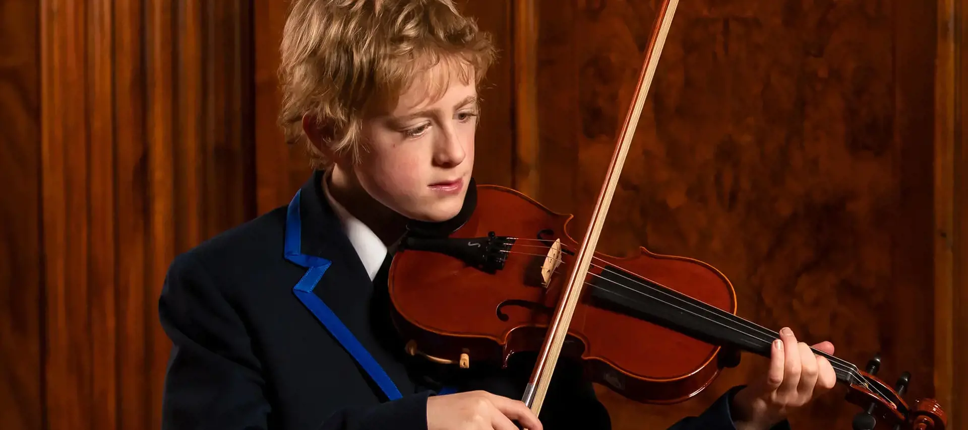 A pupil at The Gregg School playing violin