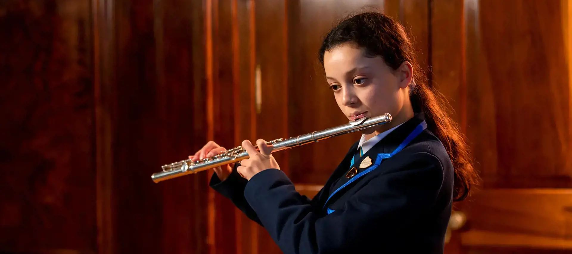 Pupil at The Gregg School playing flute