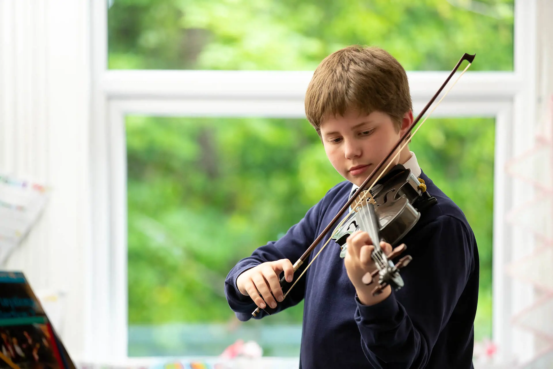 Student playing violin at The Gregg Prep School