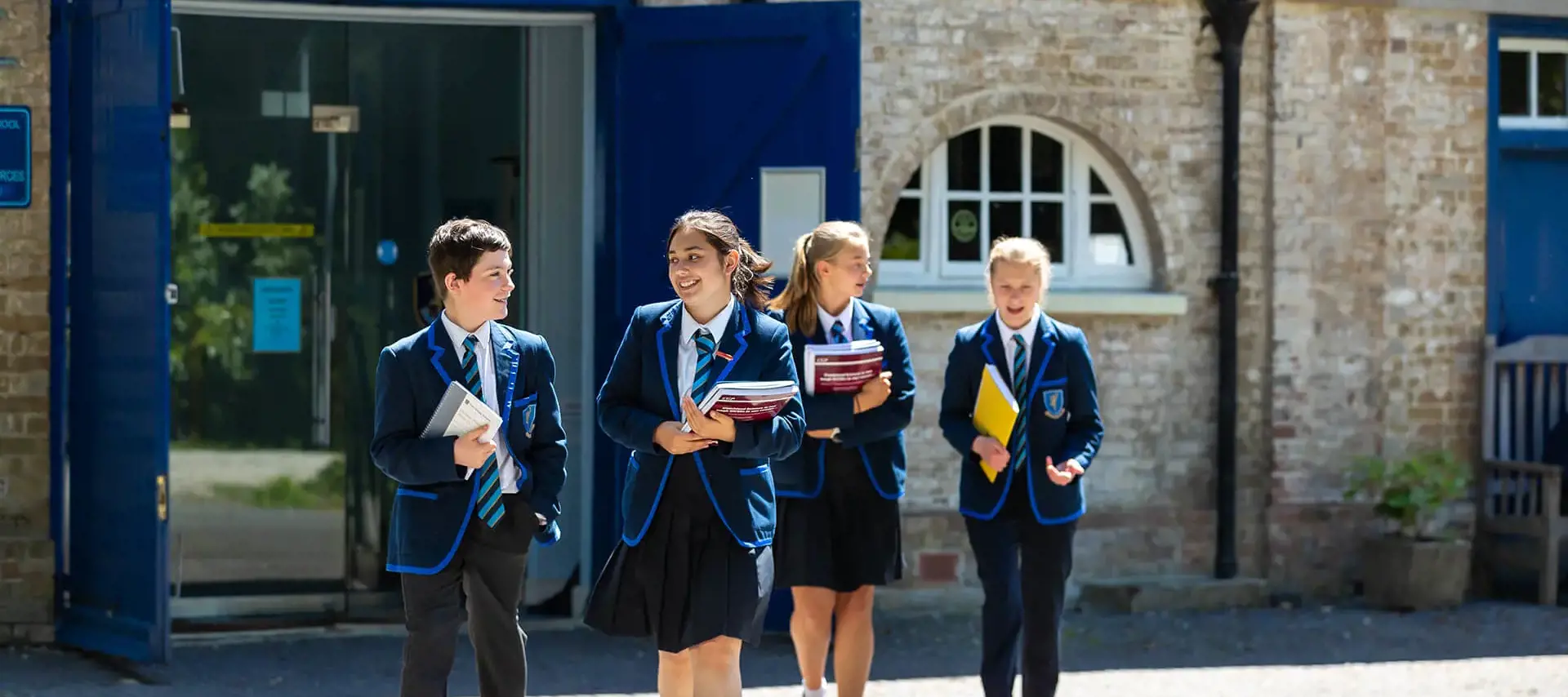 Senior school pupils in the school grounds at The Gregg School